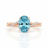 Oval-Cut Blue Topaz Ring in 14K Rose Gold with Pavé Diamond Twisted Shank