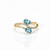 Two-Stone Oval Blue Topaz Bypass Ring in 14K Yellow Gold with Pavé Diamonds