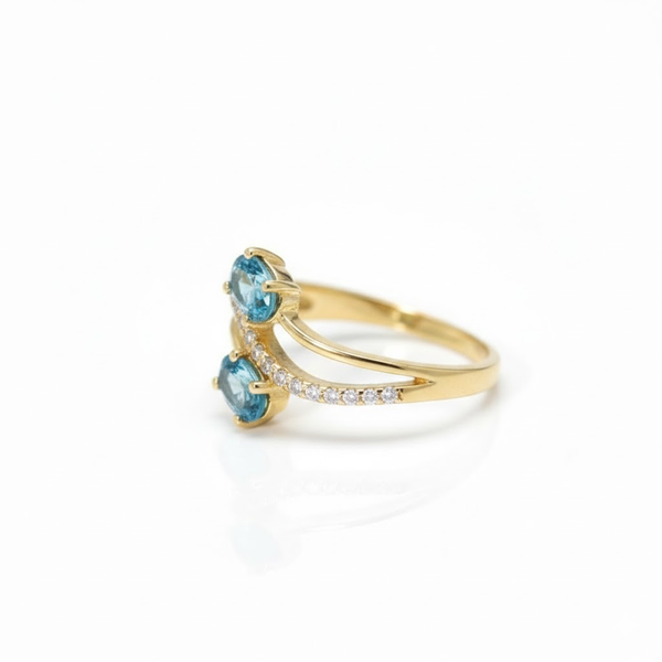 Two-Stone Oval Blue Topaz Bypass Ring in 14K Yellow Gold with Pavé Diamonds