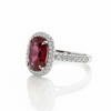 Oval Cut Lab Grown Ruby Halo Ring with Tapered Diamond Accents