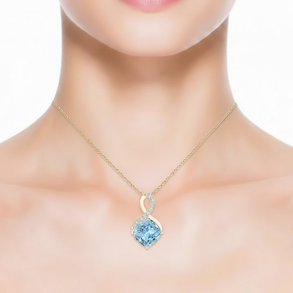 Cushion-Cut Blue Topaz Pendant in 14K Yellow Gold with Diamond Infinity Bale