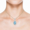 Oval Blue Topaz and Diamond Crisscross Pendant