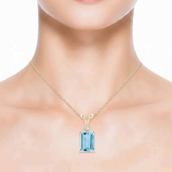 Emerald-Cut Blue Topaz Pendant in 14K Yellow Gold with Diamond V-Bale