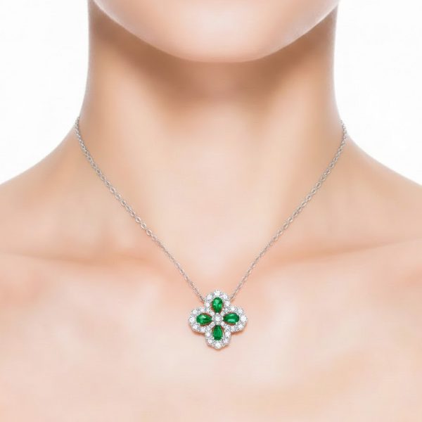 Intricate White Gold Emerald Pendant featuring a Radiant Pave Diamond Flower Motif