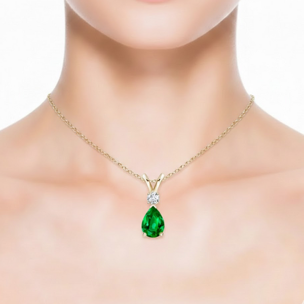 Pear-Cut Emerald Solitaire Pendant in 14K Yellow Gold with Diamond V-Bale