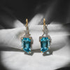 Emerald-Cut Blue Topaz Drop Earrings in 14K Yellow Gold with Diamond Accents