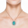 Oval-Cut Blue Topaz Halo Pendant in 14K Yellow Gold with Diamond Crisscross Bale