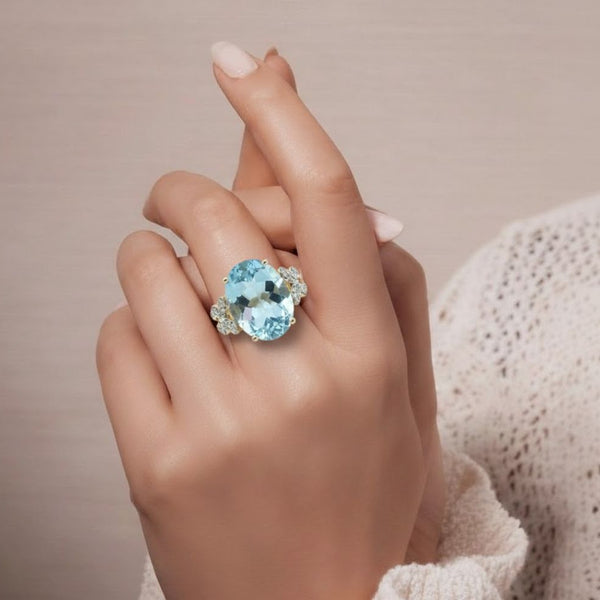 Oval-Cut Sky Blue Topaz Solitaire with Diamond Butterfly Ring