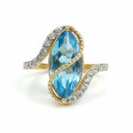 Prism of Light Opal Cabochon with Oval Ruby Surround In Diamond