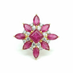 Prism of Light Opal Cabochon with Oval Ruby Surround In Diamond