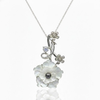 Hand-Carved White Shell Floral Vine Pendant with Pearl Accent