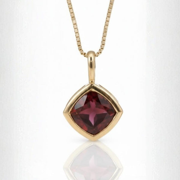 Bazel Cut Garnet In Gold Pendent