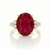 Majestic Oval Ruby Gold Ring with Brilliant Round Diamond Side Stones