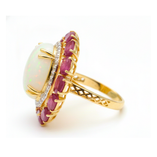 Prism of Light Opal Cabochon with Oval Ruby Surround In Diamond