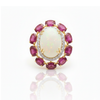 Prism of Light Opal Cabochon with Oval Ruby Surround In Diamond