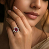 Oval Cut Lab Grown Ruby Halo Ring with Tapered Diamond Accents