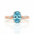 Oval-Cut Blue Topaz Ring in 14K Rose Gold with Pavé Diamond Twisted Shank
