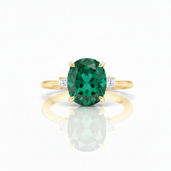 Oval Cut Emerald and Lab Grown Diamond Three-Stone Ring