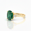 Oval Cut Emerald and Lab Grown Diamond Three-Stone Ring