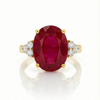 Majestic Oval Ruby Gold Ring with Brilliant Round Diamond Side Stones