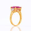 Majestic Oval Ruby Gold Ring with Brilliant Round Diamond Side Stones