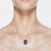 Oval-Cut Amethyst Solitaire Pendant in 14K Yellow Gold with Diamond-Set Bale
