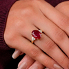 Majestic Oval Ruby Gold Ring with Brilliant Round Diamond Side Stones