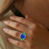 Blue Sapphire Solitaire with Cushion-Cut Emerald Side Stones Lab Grown Diamond